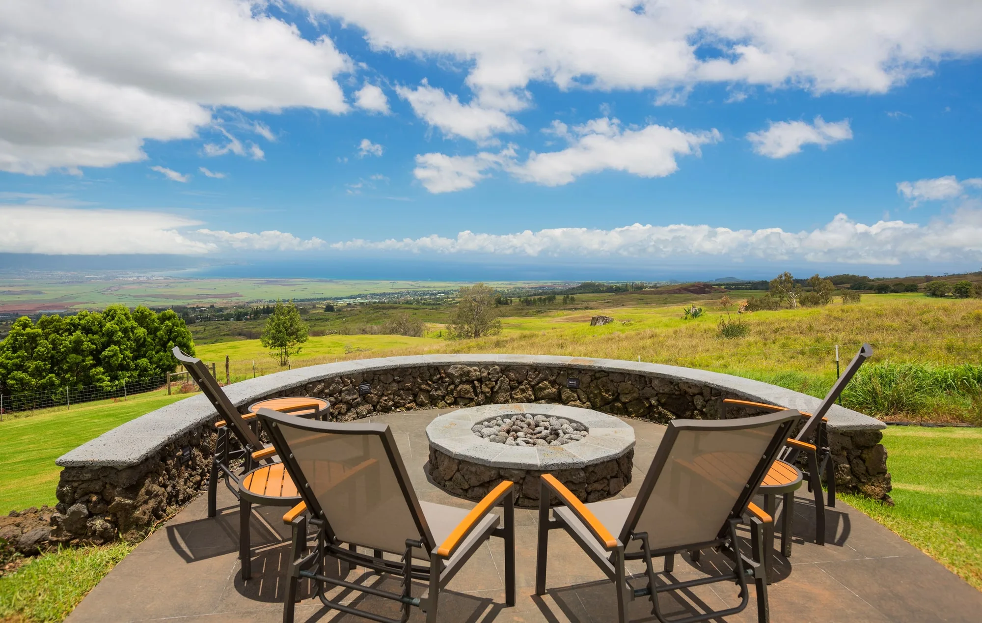 Stone fire pit with panoramic garden outlook