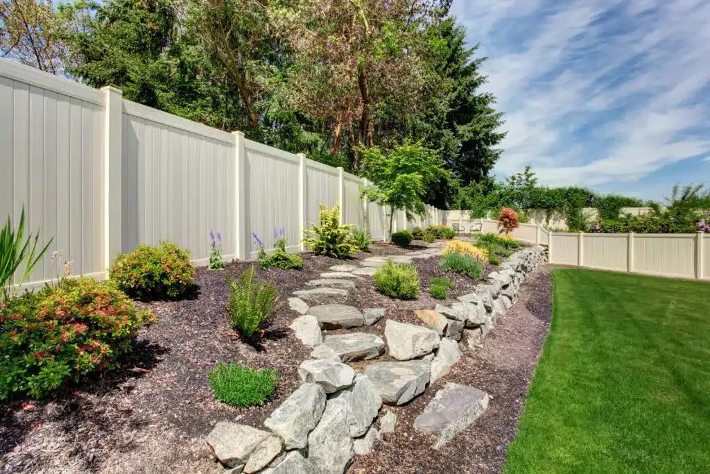 Front garden path with natural stone edging and lawn