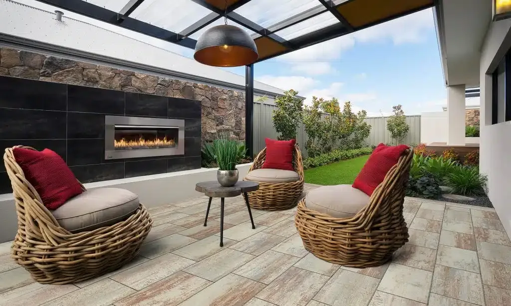 Pergola-covered patio with an outdoor fireplace and lounge seating